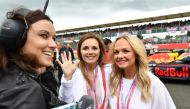 File Photo: In this file photo taken on July 10, 2016 Former singers from the British Band the Spice Girls, Geri Halliwell (C), and Emma Bunton (R) pose for a photograph as they stand with the Infiniti Red Bull racing team on the track ahead of the Britis