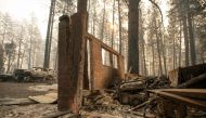 A wall is all that remains of a home after the Camp fire tore through the area in Paradise, California, on November 10, 2018. / AFP / Josh Edelson 