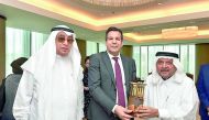 Sheikh Faisal bin Qasim Al Thani (right), QBA Chairman, presenting a momento to the Algerian Minister Said Djellab, in the presence of Hussein Al Fardan, QBA’s First Deputy.