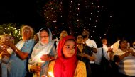 Women hold candles during a vigil campaign demanding democracy in the country, in Colombo, Sri Lanka November 11, 2018.REUTERS/Dinuka Liyanawatte