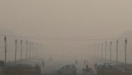 People commute on a smoggy morning in New Delhi, India, November 12, 2018. REUTERS/Anushree Fadnavis
