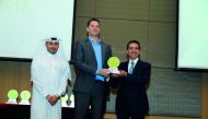 A Qatar sustainability award winner with the officials.
