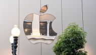 (FILES) In this file photo taken on September 22, 2017 an Apple logo is seen on the outside of an Apple store in San Francisco, California. AFP / Josh Edelson