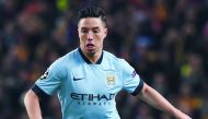 In this file photo taken on February 24, 2015 Manchester City's French midfielder Samir Nasri runs with the ball during the UEFA Champions League round of 16 first leg football match between Manchester City and Barcelona at the Etihad Stadium in Mancheste