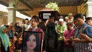 Family and colleagues carry the coffin of Alfiani Hidayatul Solikah, a cabin crew member of Lion Air flight JT610, during the funeral at Mojorejo village in Madiun, Indonesia November 14, 2018. Antara Foto/Siswowidodo via Reuters