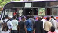 Commuters board a bus as police kicked off a major crackdown targeting non-compliant Public Service Vehicles (PSV) operators country wide, in Nairobi, on November 12, 2018. AFP / Simon Maina 