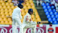 England's Sam Curran (R) plays a shot as Sri Lanka's wicketkeeper Niroshan Dickwella (L) looks on during the first day of the second Test match between Sri Lanka and England at the Pallekele International Cricket Stadium in Kandy on November 14, 2018. AFP