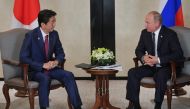 Japanese Prime Minister Shinzo Abe and Russian President Vladimir Putin attend a meeting on the sidelines of the ASEAN-Russia Summit in Singapore, November 14, 2018. Sputnik/Alexei Druzhinin/Kremlin via 