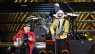 Roy Clark(L) and Brad Paisley perform onstage at the 50th annual CMA Awards at the Bridgestone Arena in Nashville, Tennessee on November 2, 2016.  AFP / Getty Images North America / Gustavo Caballero 