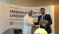 Yousuf Mohamed Al Jaida (left), CEO of Qatar Financial Centre, shaking hands with the official of  LexisNexis, after the signing of the MoU in Doha.