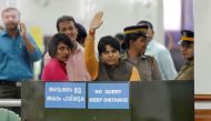 Trupti Desai, a women's rights activist, waves from inside the Cochin International Airport at Kochi, India, November 16, 2018. Reuters /Sivaram V