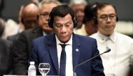 Philippine President Rodrigo Duterte attends the ASEAN-Plus Three (APT) summit on the sidelines of the 33rd Association of Southeast Asian Nations (ASEAN) summit in Singapore on November 15, 2018. AFP / Lillian Suwanrumpha 