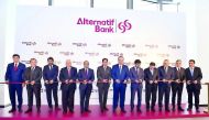 Top executives of Commercial Bank and Alternatif Bank cutting the ceremonial ribbon to mark the opening of Alternatif Bank head office in Istanbul.