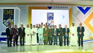 Doha Bank CEO Dr R Seetharaman and other officials with the winners. 