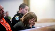 Paradise Town Manager Lauren Gill cries during a vigil for Camp Fire victims on Sunday, November 18, 2018, at the First Christian Church of Chico in Chico, California. AFP / POOL / Noah Berger