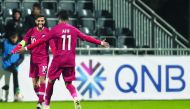 Qatar skipper Hassan Al Haydos celebrates with team-mate Akram Afif after scoring the opening goal in yesterday’s match against Iceland.