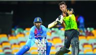 Australia's batsman Glenn Maxwell (R) hits a shot off the bowling of India's Krunal Pandya during the T20 international cricket match between Australia and India in Brisbane on November 21, 2018. AFP / Patrick Hamilton