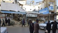 People are seen around the damaged buildings after 6.4 magnitude earthquake that hit western Iran near the border with Iraq, in Kermanshah, Iran on November 26, 2018. Stringer - Anadolu 
