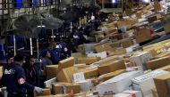 FedEx personnel sort boxes at the company's Memphis World Hub during the company's busiest overall volume night of the year in Memphis, Tennessee, US, December 15, 2009. Reuters/Lance Murphey