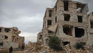 This picture taken on November 26, 2018 shows a damaged building in the Syrian rebel-held al-Rashidin district of western Aleppo's countryside near Idlib province.  AFP / Aaref Watad
