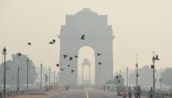 Indian pedestrians walk near the India Gate monument amid heavy smog in New Delhi, October 28. (AFP) 