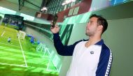 South African Olympic champion Chad Le Clos taking a photograph of the Aspire facilities. 