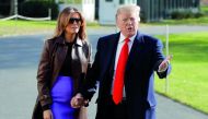 US President Donald Trump talks to reporters with first lady Melania Trump as they depart for travel to the G-20 summit in Argentina from the White House in Washington, U.S., November 29, 2018. Reuters/Jim Young 
