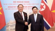 Vietnamese Foreign Minister Pham Binh Minh (R) shakes hands with his North Korean counterpart Ri Yong Ho (L) at the Government guesthouse in Hanoi, Vietnam, November 30, 2018. MINH HOANG/Pool via REUTERS