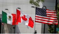 File photo of the flags of US, Canada and Mexico fly next to each other in Detroit, Michigan, US, August 29, 2018. REUTERS/Rebecca Cook/File Photo