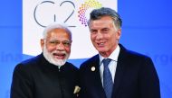 India's Prime Minister Narendra Modi (L) is welcomed by Argentina's President Mauricio Macri at Costa Salguero in Buenos Aires during the G20 Leaders' Summit, on November 30, 2018.  AFP / Alexander Nemenov