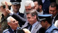 Brazil's President-elect Jair Bolsonaro waves as he attends the graduation of officers of the School of Aeronautical Specialists in Guaratingueta, Brazil November 30, 2018. Reuters/Paulo Whitaker