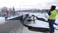 A stranded vehicle lies on a collapsed roadway near the airport after an earthquake in Anchorage, Alaska, U.S. November 30, 2018. REUTERS/Nathaniel Wilder