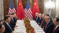US President Donald Trump (2-R) US Secretary of the Treasury Steven Mnuchin (R) and members of their delegation have dinner with China's President Xi Jinping (3-L) and Chinese government representatives, at the end of the G20 Leaders' Summit in Buenos Air