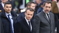French President Emmanuel Macron (C) inspects the damages a day after clashes during a protest of Yellow vests (Gilets jaunes) against rising oil prices and living costs, in Paris, France on December 2, 2018. ( Zakaria Abdelkafi - Anadolu