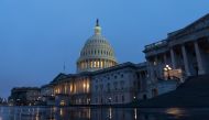 The US flag flies at half-staff in front of the US Capitol in tribute to former US President George H. W. Bush, early on December 2, 2018, in Washington, DC. / AFP / Alex Edelman 