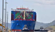 Chinese Cosco Shipping Rose container ship sails the newly inaugurated Cocoli locks, during the visit of China's President Xi Jinping, in the Panama Canal, on December 3, 2018, in the Panama Canal, on December 3, 2018. / AFP / Luis Acosta 