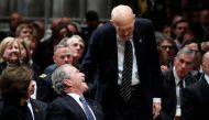 Former Sen. Alan Simpson (R-WY) speaks with former President George Bush as he walks to a podium to speak during the State Funeral for former President George H.W. Bush at the National Cathedral, Wednesday, Dec. 5, 2018, in Washington. Alex Brandon/Pool v