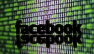 FILE PHOTO - A 3D printed Facebook logo is seen in front of displayed cyber code in this illustration taken March 22, 2016. REUTERS/Dado Ruvic/Illustration/File Photo