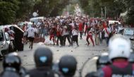 River Plate's fans clash with riot police after the match was postponed. REUTERS/Alberto Raggio
