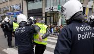 Policemen arrest protestors during a copycat 