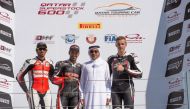 Minister of Culture and Sports H E Salah bin Ghanem Al Ali  poses for a photograph with the podium winners of the Qatar Superstock 600, Race 1, Qatari riders Saeed Al Sulaiti (second, left), Mishal Al Naimi and Hungarian rider Balint Kovacs  (right) durin