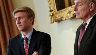 FILE PHOTO: Nick Ayers (L), chief of staff to U.S. Vice President Mike Pence, and White House Chief of Staff John Kelly look on as U.S. President Donald Trump holds a cabinet meeting at the White House in Washington, U.S. May 9, 2018. Picture taken May 9,