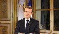 French President Emmanuel Macron speaks during a special address to the nation, his first public comments after four weeks of nationwide 'yellow vest' (gilet jaune) protests, on December 10, 2018, at the Elysee Palace, in Paris. / AFP / LUDOVIC MARIN
