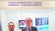 Senior officials of QICC at its pavilion in Amman