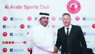 Sheikh Khalifa bin Hamad Al Thani, President of the Al Arabi Club, poses with new Al Arabi coach Heimir Hallgrimsson after a press conference in Doha, yesterday. 