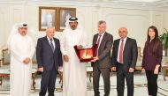 QC First Vice-Chairman Mohamed bin Ahmad bin Towar presenting a memento to Palestinian trade and business delegation head.