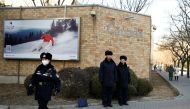 Police keep watch outside the embassy of Canada in Beijing, China, December 12, 2018. REUTERS/Thomas Peter