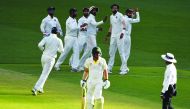 India's paceman Ishant Sharma (2nd R) celebrates with teammates the dismissal of Australia's batsman Peter Handscomb during day one of the second Test cricket match between Australia and India in Perth on December 14, 2018. AFP / William West 
