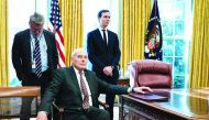 White House communications director Bill Shine (L), White House Chief of Staff John Kelly (C), and Senior Advisor Jared Kushner in Oval Office on December 11, 2018.  AFP / Brendan Smialowski

