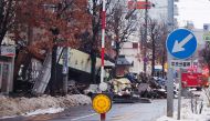 Firefighters inspect the site of an explosion at a restaurant in Sapporo, Hokkaido prefecture on December 17, 2018. Japan OUT / AFP / JIJI PRESS / JIJI PRESS 